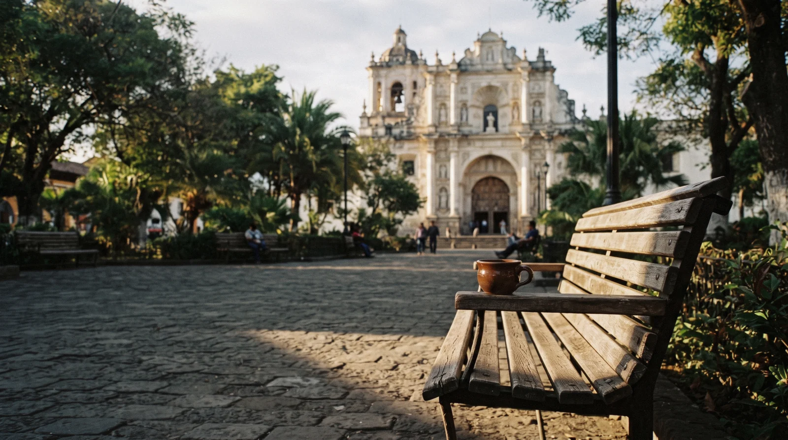 The Santa Catalina Arch seen down 5a Avenida Norte with Volcan de Agua behind, the view that anchors this one-day route through Antigua Guatemala