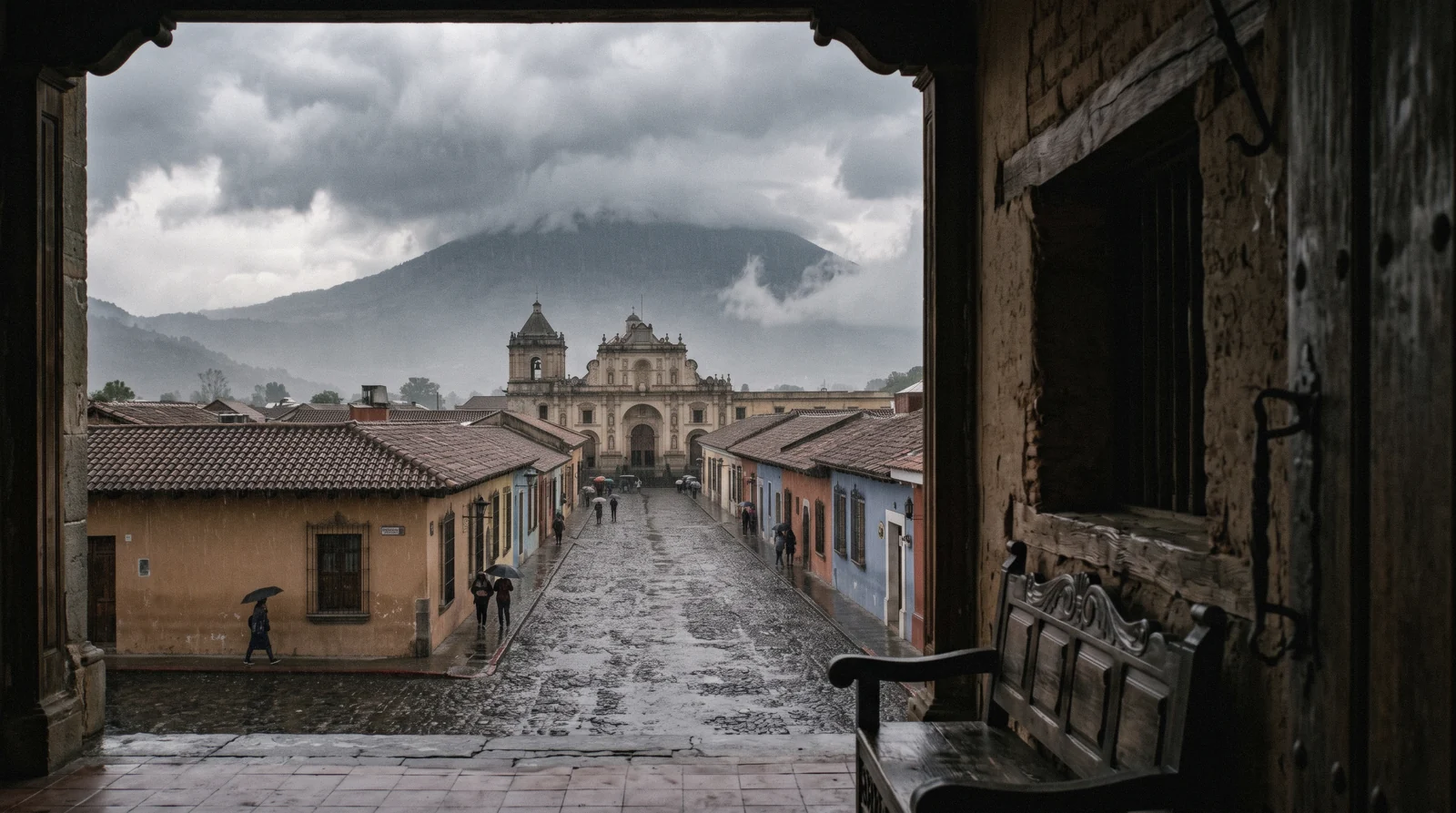 Cloud spilling over the volcanoes above Antigua Guatemala's rooftops, the daily face of antigua guatemala weather